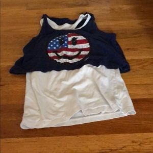 A blue and white two tiered smiley face tank top.